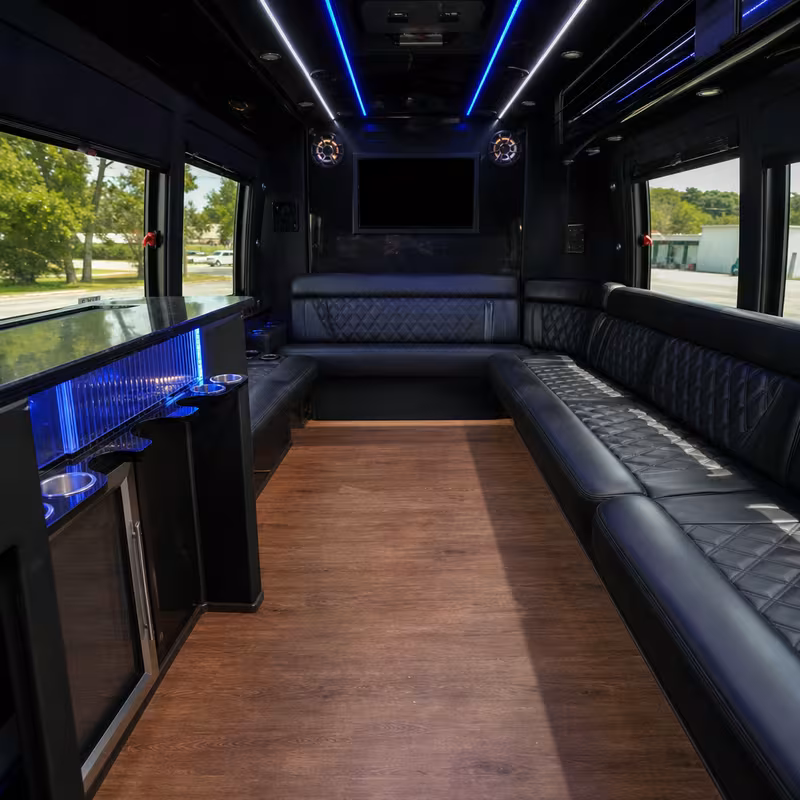 Friends laughing during a San Diego party bus celebration