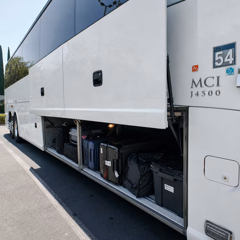 Party bus interior with wraparound leather seating and LED lighting in San Diego