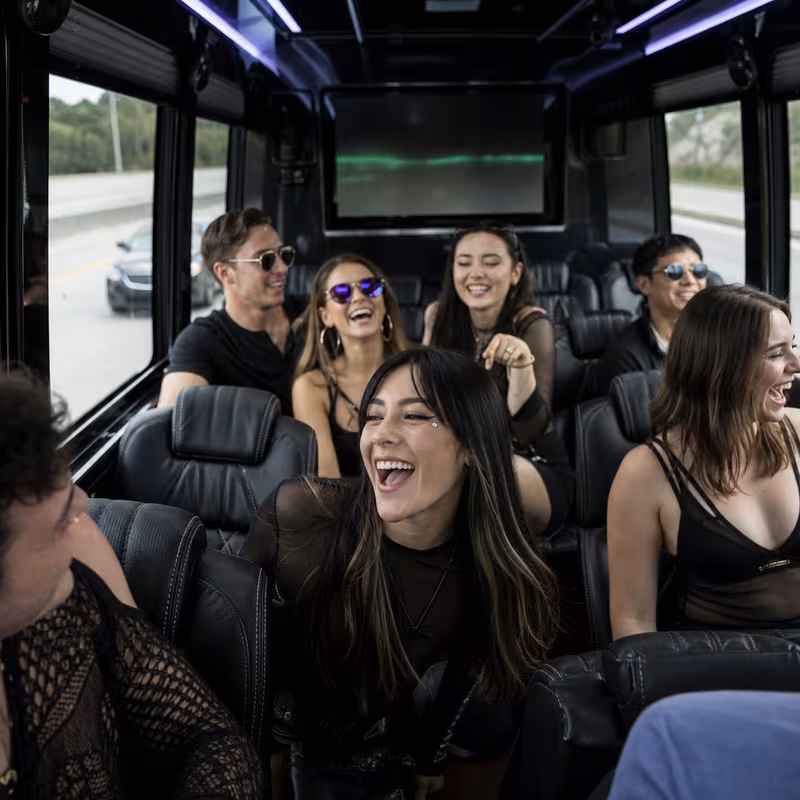 Passengers loading luggage while boarding an San Diego group shuttle