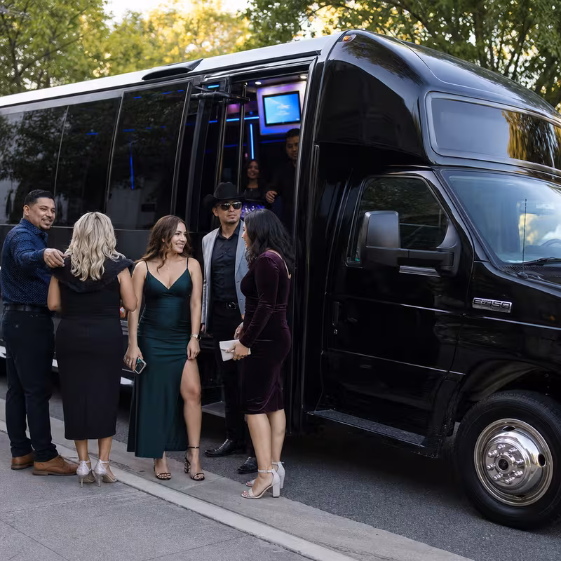 Passengers loading luggage while boarding an San Diego group shuttle