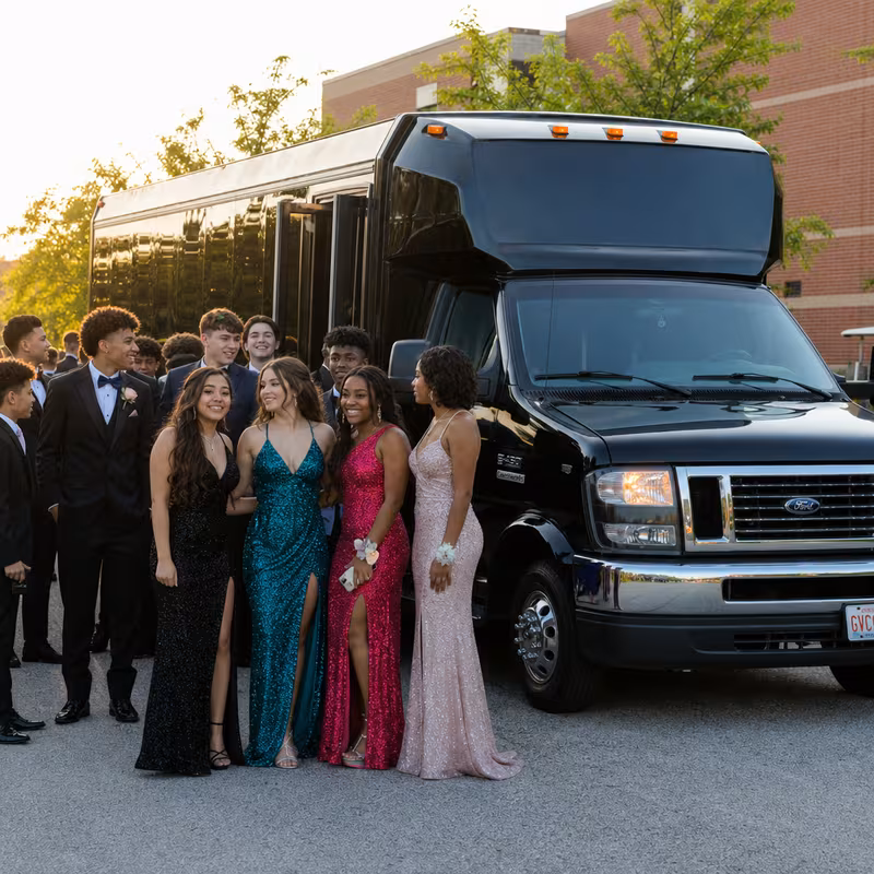Group boarding a white charter bus for Prom & Homecoming Transportation transportation in San Diego