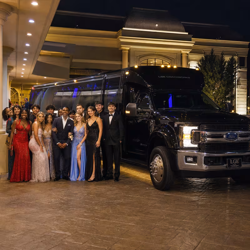 Party bus interior with wraparound leather seating and LED lighting in San Diego