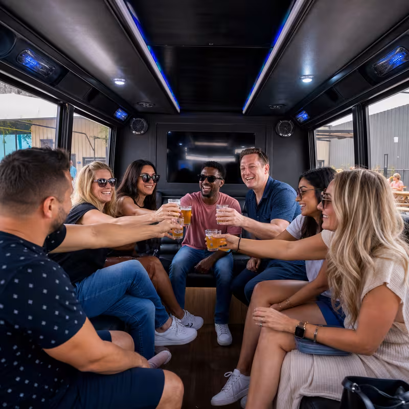 Group boarding a white charter bus for Winery & Brewery Tour Transportation transportation in San Diego